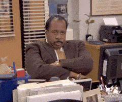 Man in Suit Sitting at Desk