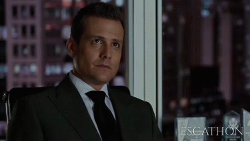Man In Suit Sitting By Window Escathon GIF