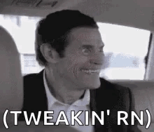 Man in Suit Sitting in Back Seat of Car