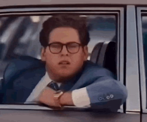 Man in Suit Sitting in Car
