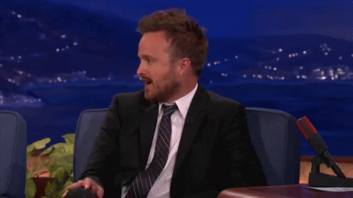 Man In Suit Sitting In Chair GIF
