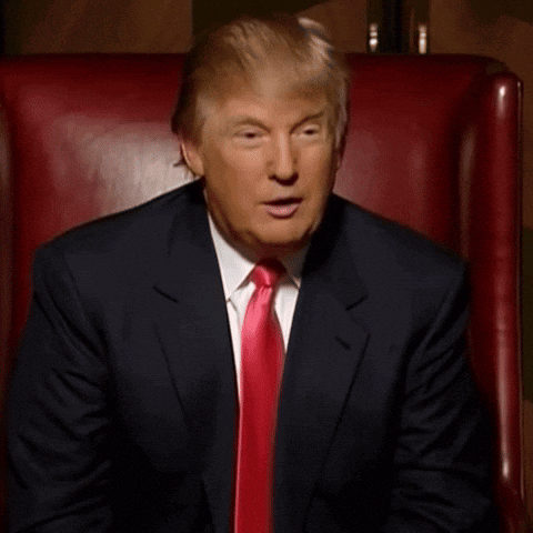 Man in Suit Sitting in Chair