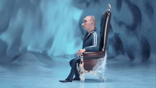 Man in Suit Sitting in Chair With Smoke
