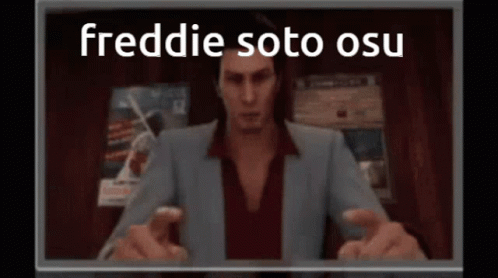 Man in Suit Sitting in Front of Freddie Soto OSU Screen