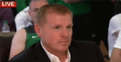 Man in Suit Sitting in Front of Live Screen