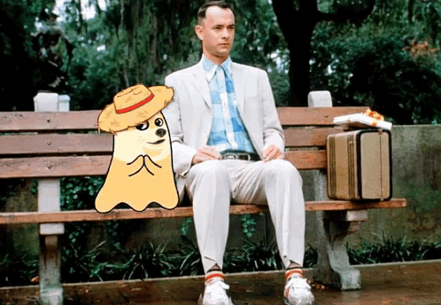 Man in Suit Sitting Next to Cartoon Ghost