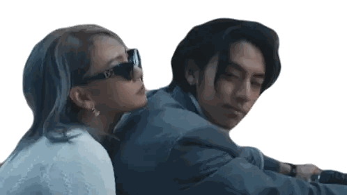 Man in Suit Sitting Next to Woman