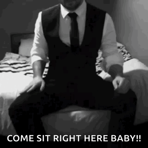 Man in Suit Sitting on Bed Come Sit Baby