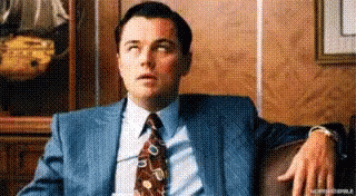 Man in Suit Sitting on Couch