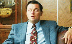 Man in Suit Sitting on Couch