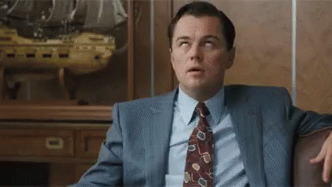 Man in Suit Sitting on Couch
