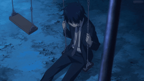 Man in Suit Sitting on Swing