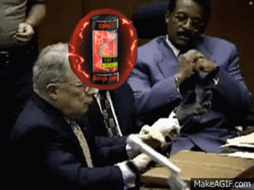 Man in Suit Sitting with Energy Drink