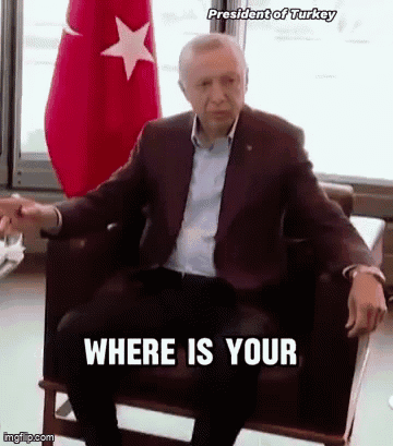 Man in Suit Sitting with Where Is Your