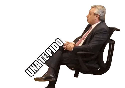 Man in Suit Sitting with Words Behind Him