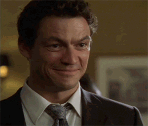 Man in Suit Smiling and Making Funny Face