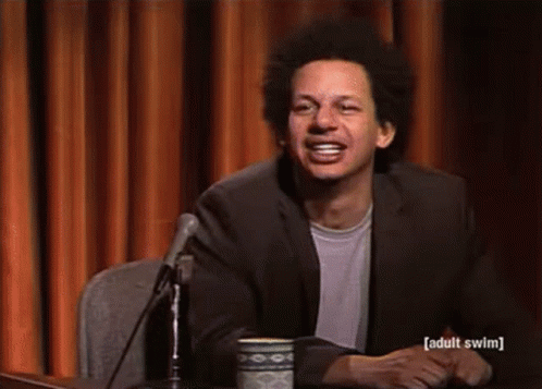 Man In Suit Smiling At Microphone GIF