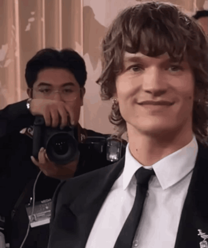 Man in Suit Smiling for Photo