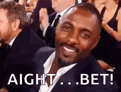 Man In Suit Smiling In Crowd GIF
