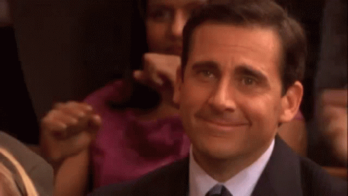 Man in Suit Smiling in Theatre