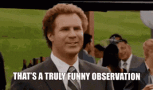 Man in Suit Smiling Says Funny Observation