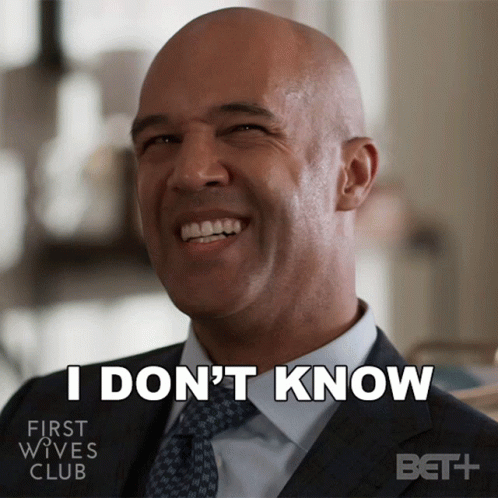 Man in Suit Smiling Says I Don't Know