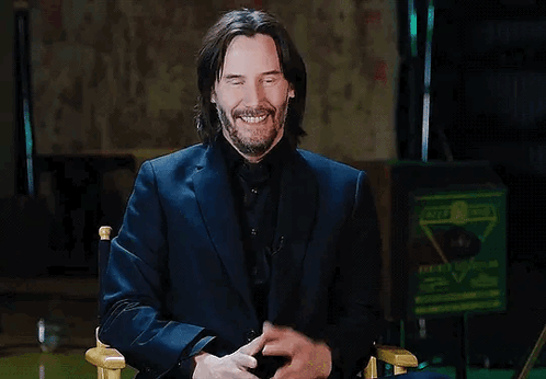 Man in Suit Smiling Sitting