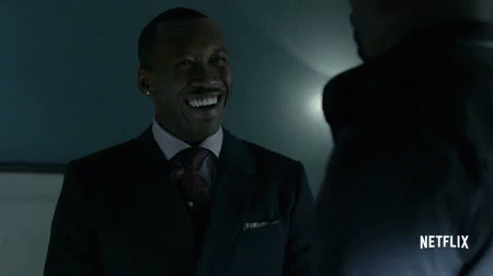 Man in Suit Smiling Talking