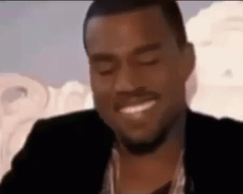 Man In Suit Smiling With Eyes Closed GIF