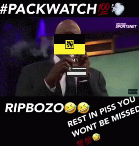Man In Suit Smoking Behind Yellow Flag GIF