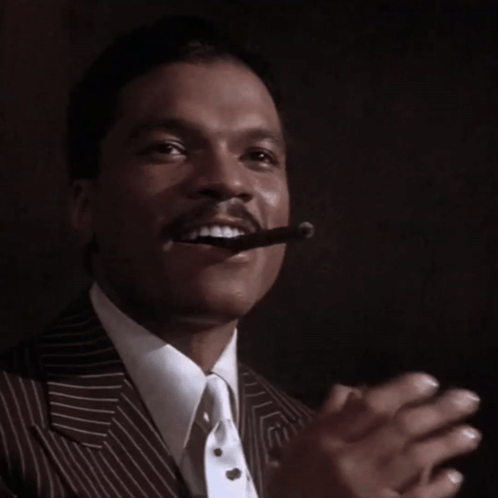 Man in Suit Smoking Cigar
