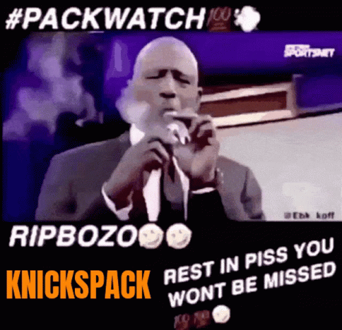 Man In Suit Smoking Cigarette At Microphone GIF