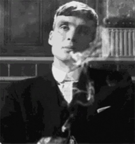 Man in Suit Smoking Cigarette Black and White