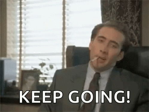 Man in Suit Smoking Cigarette Keep Going