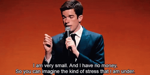 Man in Suit Speaking Into Microphone