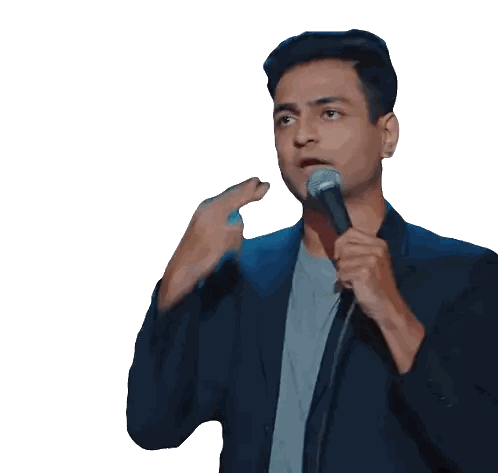 Man in Suit Speaking Into Microphone