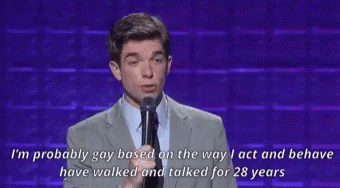 Man in Suit Speaking Into Microphone