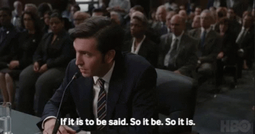 Man In Suit Speaking Into Microphone If It Is To Be Said So It Be So It Is GIF