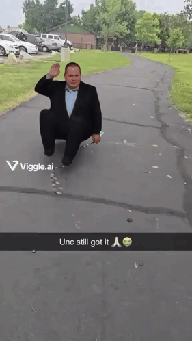 Man in Suit Squatting Unc Still Got It