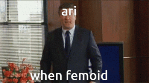 Man in Suit Standing at Window Saying Ari When Femoid