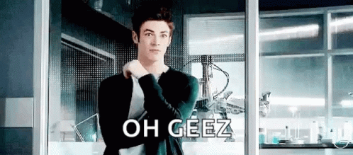Man In Suit Standing At Window Saying Oh Geez GIF