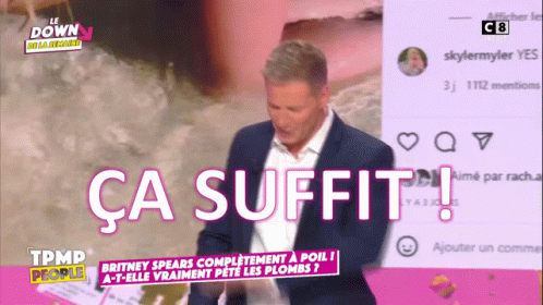 Man In Suit Standing Before Ca Suffit Screen GIF