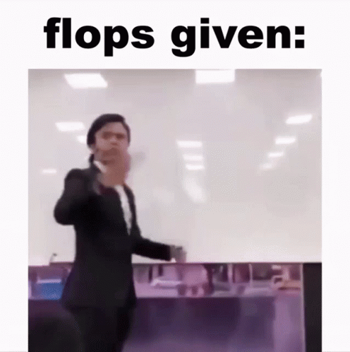 Man In Suit Standing Before Flops Given GIF