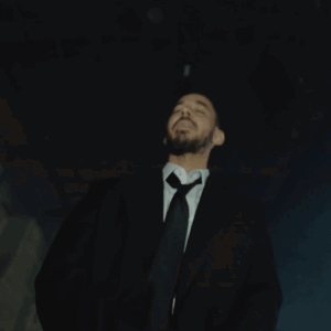 Man In Suit Standing Before Right Sign GIF