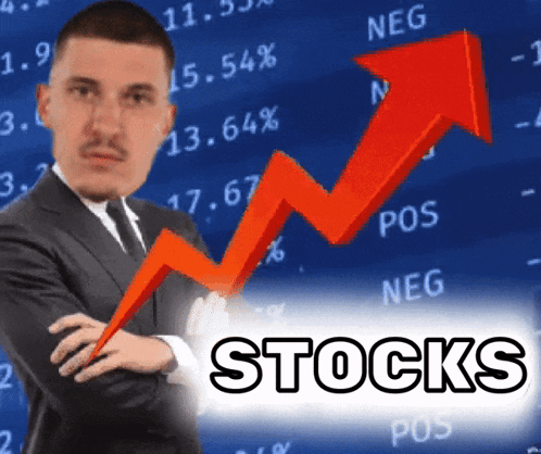 Man in Suit Standing Before Stocks Graph