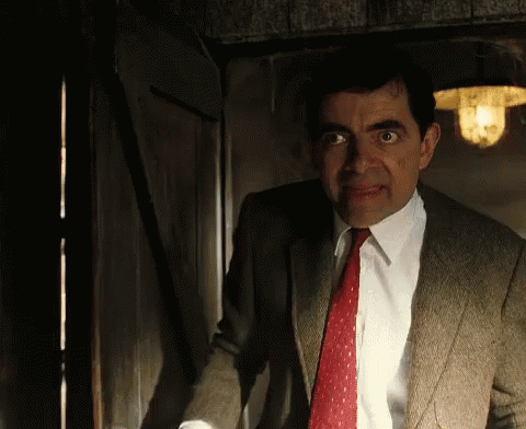 Man In Suit Standing In Doorway GIF