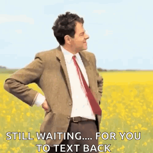 Man in Suit Standing in Field