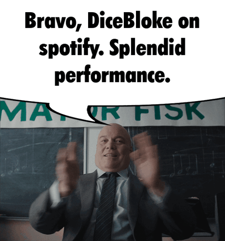Man in Suit Standing in Front of Bravo Dicebloke Sign