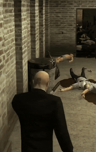 Man in Suit Standing in Front of Brick Wall With Dead People