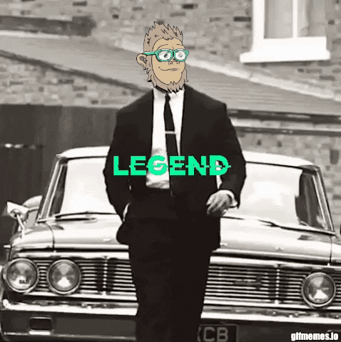 Man in Suit Standing in Front of Car Saying Legend